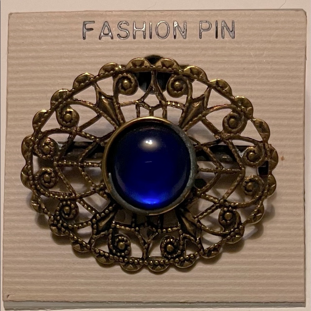 Vintage gold plated with blue stone